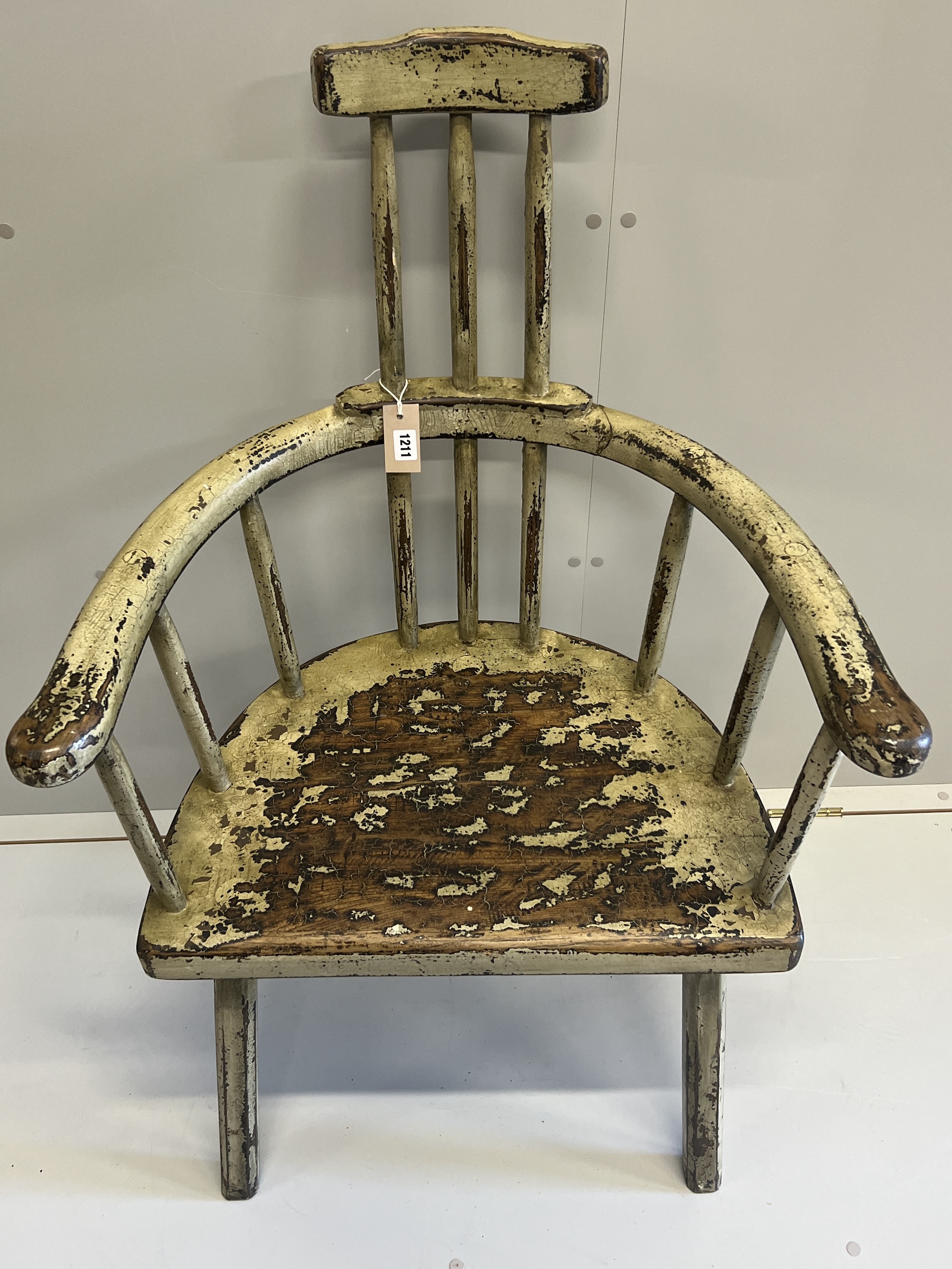 An 18th century style painted hardwood primitive elbow chair, width 68cm, depth 44cm, height 108cm